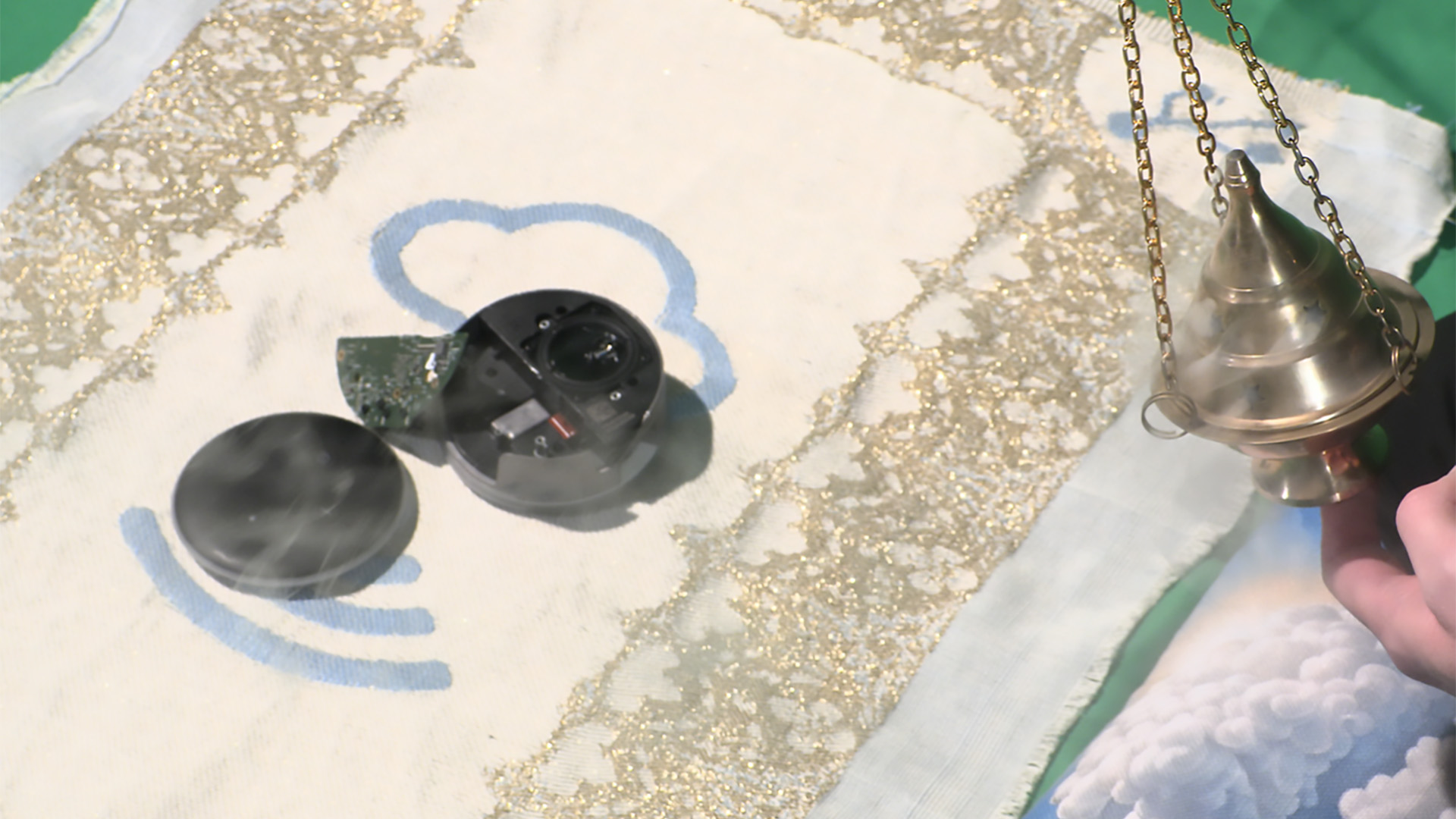 Ritual unbinding of an Amazon Alexa, smoke, and tablecloth